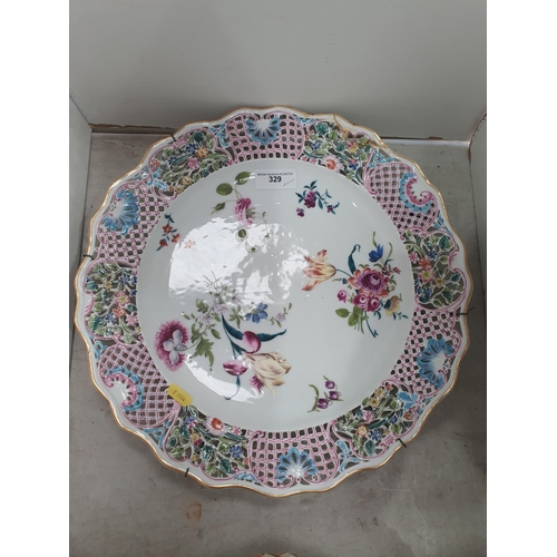 329 - Six hand painted Dresden Plates with pierced rims, with central floral decorations, 9