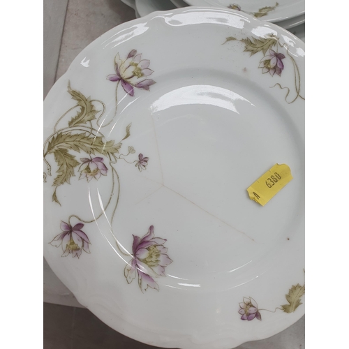 330 - A Continental Porcelain part Dinner Service with floral designs including, Sauce Boats, Plates, Side... 