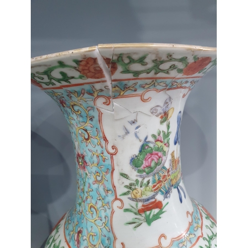 335 - A pair of 19th Century Chinese famille rose Vases of baluster form decorated panels of exotic birds ... 