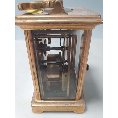 341 - Four various brass-cased Carriage Clocks and a Siemens Bros brass cased Compass, 3 1/2in diam, (R5)