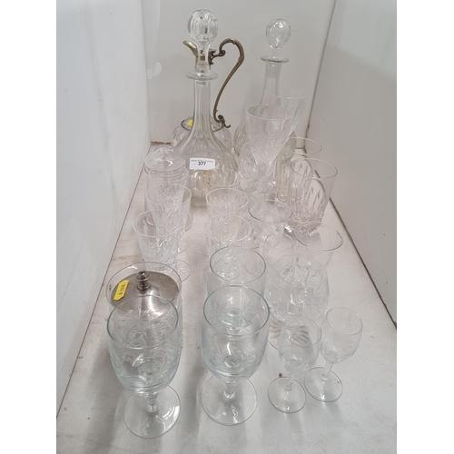 377 - A glass Ewer with plated mounts, two glass Decanters and a quantity of Drinking Glasses, (R5)