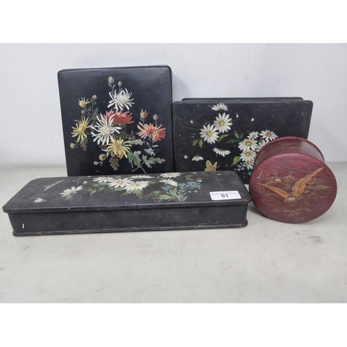 51 - Three papier mache Boxes floral painted on a black ground, and a red ground cylindrical Box decorate... 