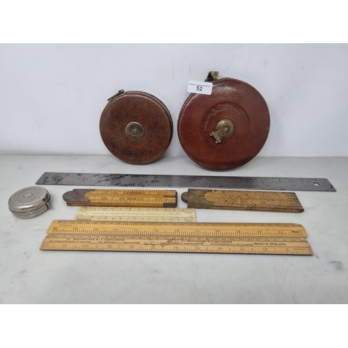 52 - Two large leather cased Tape Measures by Rabone, a steel Ruler by Chesterman, No 48, two Folding Rul... 