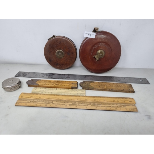 52 - Two large leather cased Tape Measures by Rabone, a steel Ruler by Chesterman, No 48, two Folding Rul... 