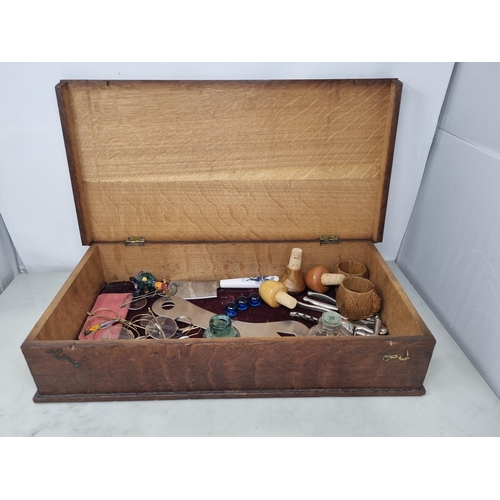 53 - An oak Box containing Spectacles, Corkscrew, Bottle Opener, glass Inkwells, Nut Crackers, Aldis Proj... 