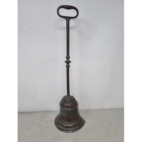 57 - A 19th century brass Doorstop of bell shape with loop handle, 16in (R2)