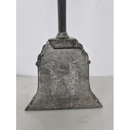 57 - A 19th century brass Doorstop of bell shape with loop handle, 16in (R2)