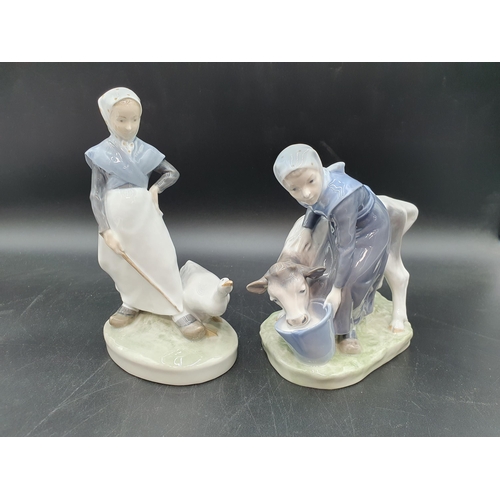 71 - A Royal Copenhagen Figure of girl and calf, No 779, and another of girl with goose, No 528 (R1)