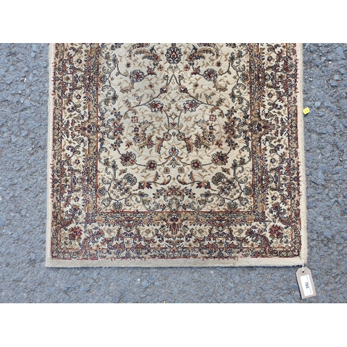 765 - A Beige bordered Runner with floral and leafage design 7ft 7