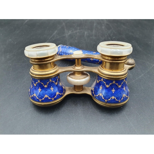 98 - A pair of blue enamel and gilt metal Opera Glasses decorated gilt floral swags A/F