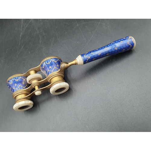 98 - A pair of blue enamel and gilt metal Opera Glasses decorated gilt floral swags A/F