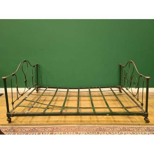 394 - A green painted French Low Bed with floral and scrolled designs, including rails and slats. (R11).