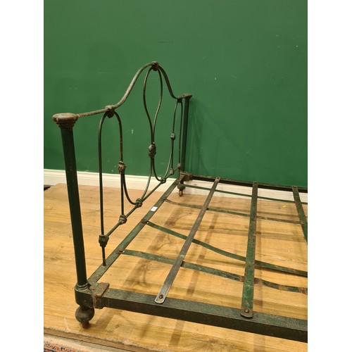 394 - A green painted French Low Bed with floral and scrolled designs, including rails and slats. (R11).