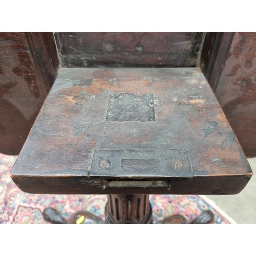 286 - A Georgian mahogany tilt-top Table with shaped dished top on fluted and spiral turned column and car... 