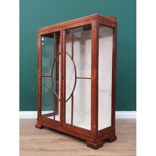 353 - A walnut Art Deco glazed Cabinet with interior glass shelves, on bracket supports, 3ft 11