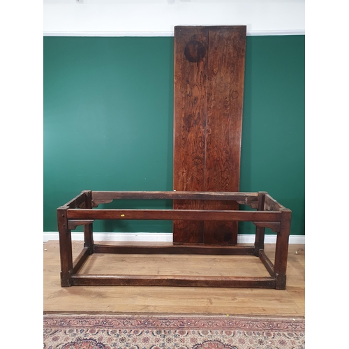 287 - An 18th Century oak Farmhouse Dining Table, the cleated two plank top above a drop frieze and corner... 