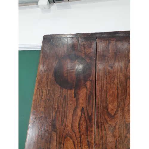 287 - An 18th Century oak Farmhouse Dining Table, the cleated two plank top above a drop frieze and corner... 