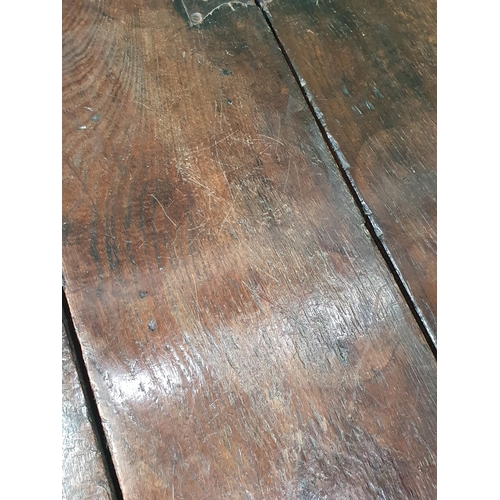 341 - An early 18th century oak Credence Table, the fold over demi-lune top above a shaped frieze and draw... 