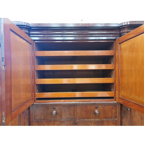 449 - A Victorian mahogany Wardrobe the centre section with pair of doors above two short and three long d... 