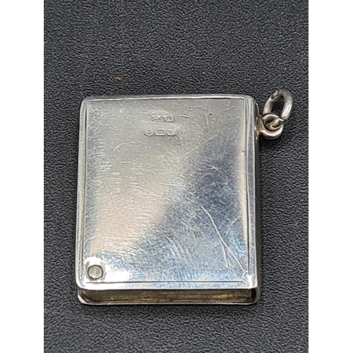 106 - A George V silver and blue enamel Pendant Stamp Case in the form of a book, Birmingham 1916