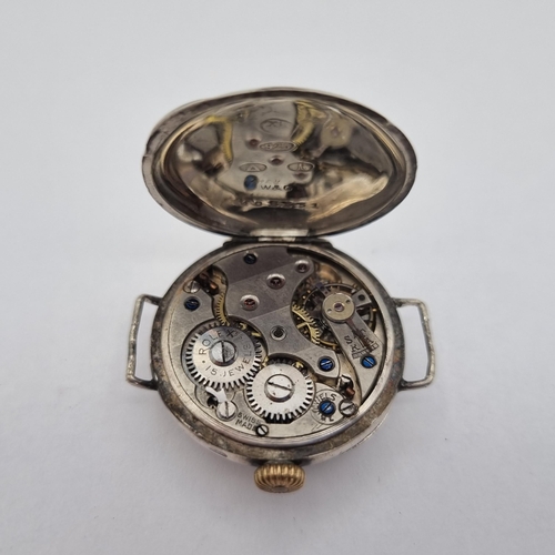 140 - An early Rolex Wristwatch the white enamel dial with arabic numerals in silver case, import marks 19... 