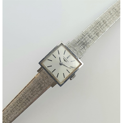 152 - A lady's Longines Wristwatch the square dial with hourly baton markers in steel case, case width app... 