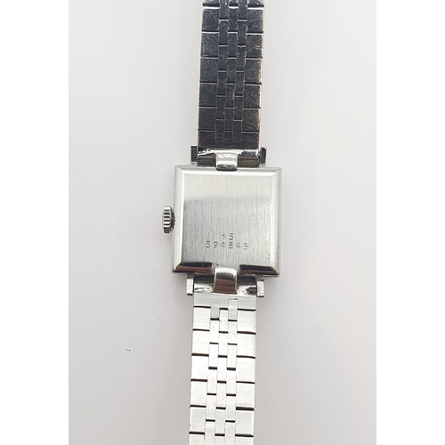 152 - A lady's Longines Wristwatch the square dial with hourly baton markers in steel case, case width app... 