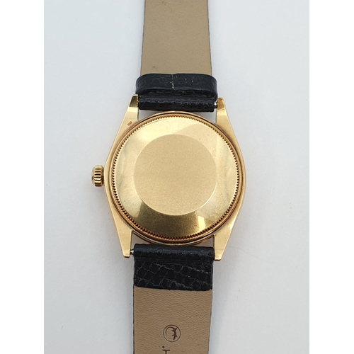 153 - A Gentleman's 1970's Rolex Oyster Perpetual Wristwatch the  brushed gold dial with hourly baton mark... 