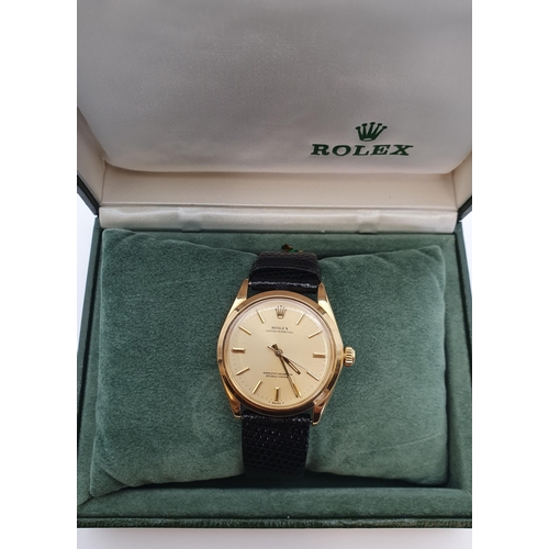 153 - A Gentleman's 1970's Rolex Oyster Perpetual Wristwatch the  brushed gold dial with hourly baton mark... 