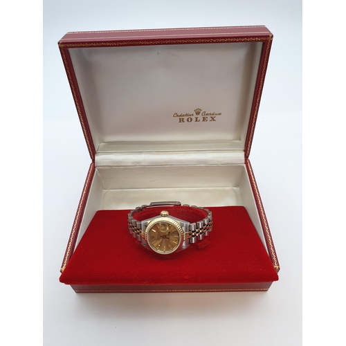 154 - A lady's 1980's Rolex Oyster Perpetual Datejust Wristwatch the brushed gold dial with hourly baton m... 