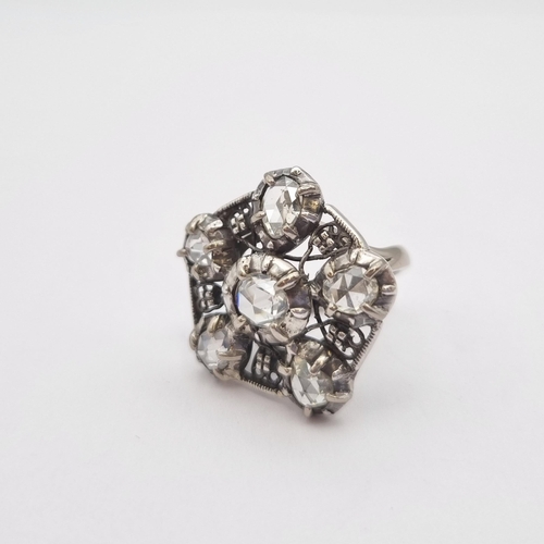 162 - A contemporary Diamond Cocktail Ring the pentagonal openwork plaque set six rose-cut stones, unmarke... 