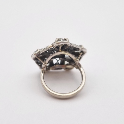 162 - A contemporary Diamond Cocktail Ring the pentagonal openwork plaque set six rose-cut stones, unmarke... 