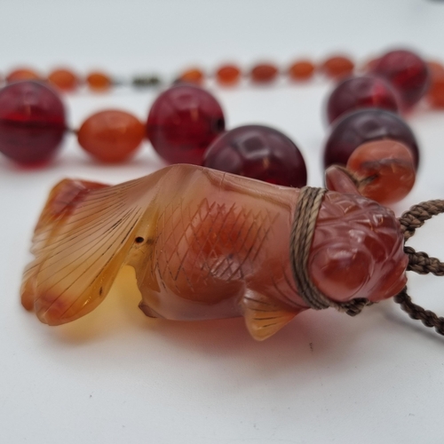 165 - An Agate and red bead Necklace with carved agate fish pendant