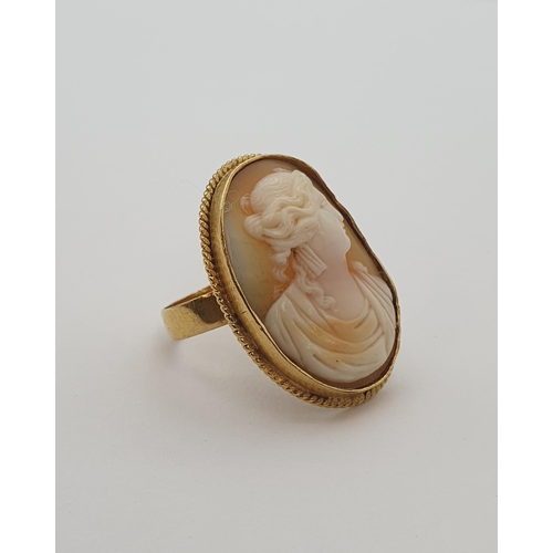 166 - A carved shell Cameo Ring of bust in profile in rope twist frame, unmarked, untested, ring size T, a... 