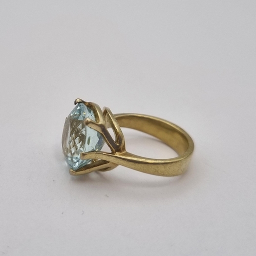 167 - An Aquamarine Ring claw-set large round mixed-cut stone, stamped 585, ring size H 1/2, approx 6.10gm... 