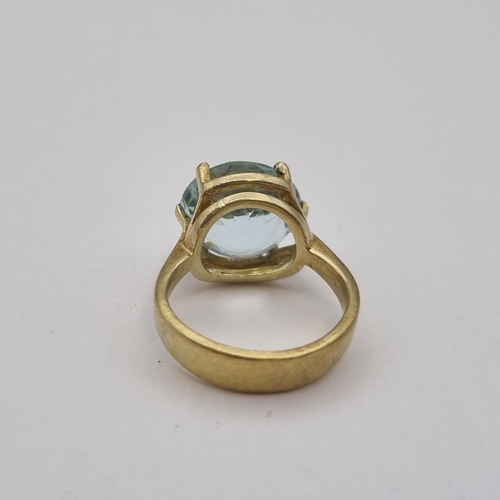 167 - An Aquamarine Ring claw-set large round mixed-cut stone, stamped 585, ring size H 1/2, approx 6.10gm... 