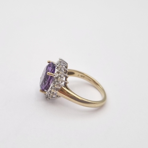 172 - An Amethyst and Diamond Cluster Ring claw-set oval mixed-cut amethyst within a frame of brilliant-cu... 