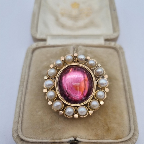 176 - A Victorian Cluster Brooch set pink foil back oval rock crystal cabochon within frame of pearls, app... 