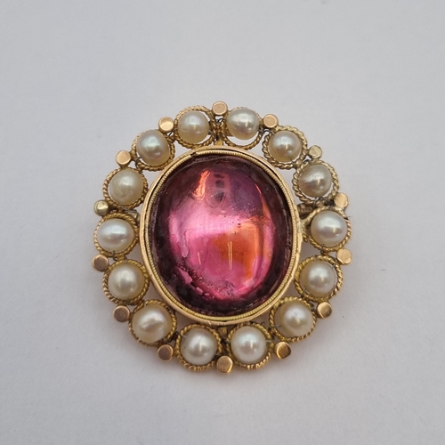 176 - A Victorian Cluster Brooch set pink foil back oval rock crystal cabochon within frame of pearls, app... 