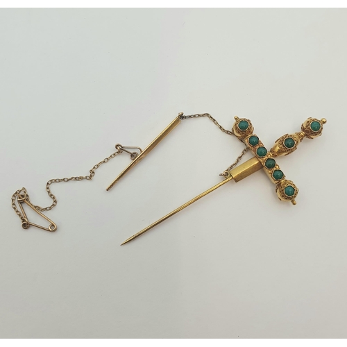 184 - A gold Jabot Pin formed a sword set turquoise, approx 7.50cms long, approx 4.70gms