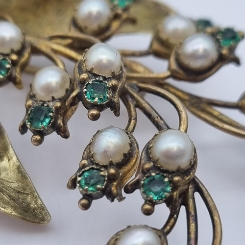 189 - A 19th Century Lily of the Valley Spray Brooch set pearls and and emeralds above engraved leaves, 9c... 