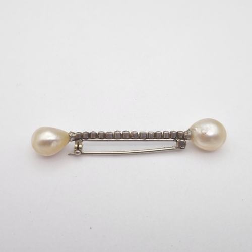 190 - A Diamond and Pearl Bar Brooch set a row of old-cut diamonds with drop shaped pearl to each end, one... 