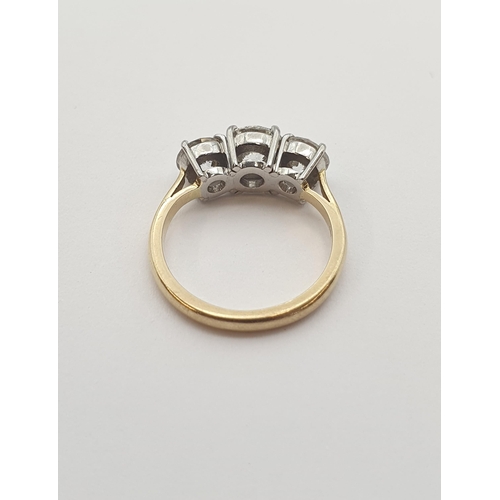 191 - A Diamond three stone Ring claw-set graduated brilliant-cut stones, estimated total diamond weight 1... 