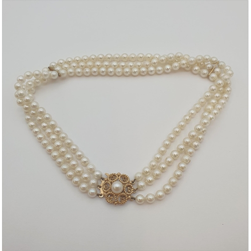 192 - A three strand Cultured South Sea Pearl Choker on 9ct gold clasp set single pearl, approx 34cms long... 