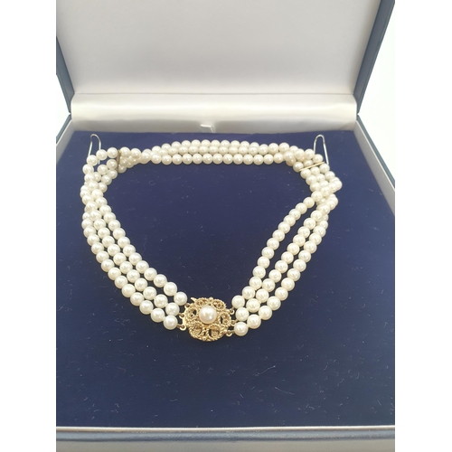 192 - A three strand Cultured South Sea Pearl Choker on 9ct gold clasp set single pearl, approx 34cms long... 