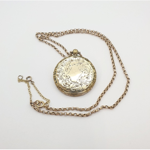 195 - A circular Locket with scroll engraving on 9ct gold Belcher Chain, approx 18.70gms all in