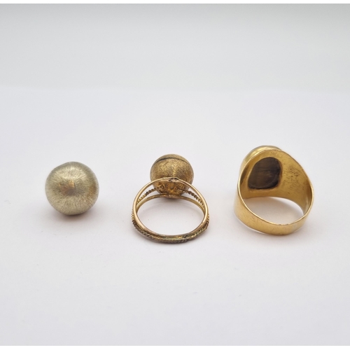 198 - A Tiger's Eye Ring set oval cabochon, unmarked, untested and a Ring set gold sphere, stamped 14K and... 