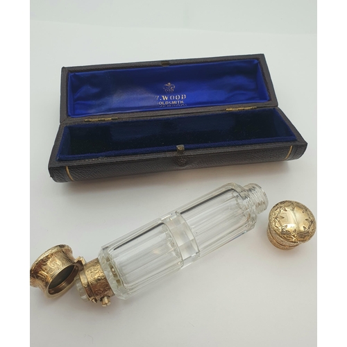 208 - A Victorian double ended faceted glass Scent Bottle, engraved gold lids, test as 9ct, by S. Mordan &... 