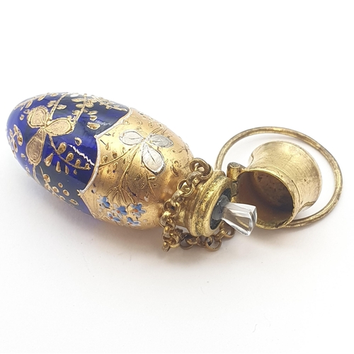 213 - A Bohemian blue glass Scent Bottle with gilt and enamel decoration, approx 5cms