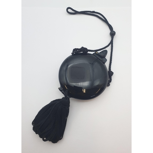 214 - A black circular French Minaudiere set paste and faux pearl, approx 8cms diameter